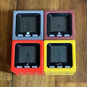 Radica Cube World Set. 4 Cube World Blocks.
All Working 2005